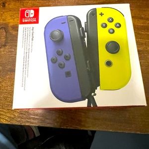 A Nintendo Switch controller Blue/Neon Yellow. Almost brand new used a few times